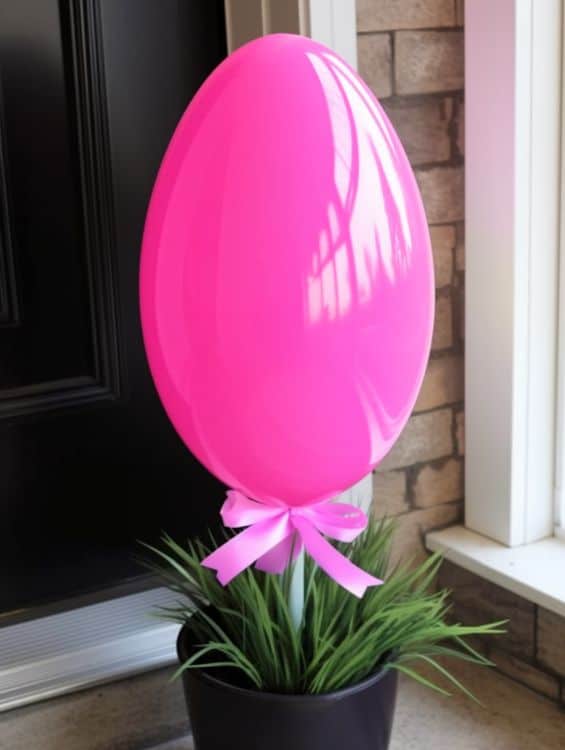 A big Easter egg in a planter for front porch decoration