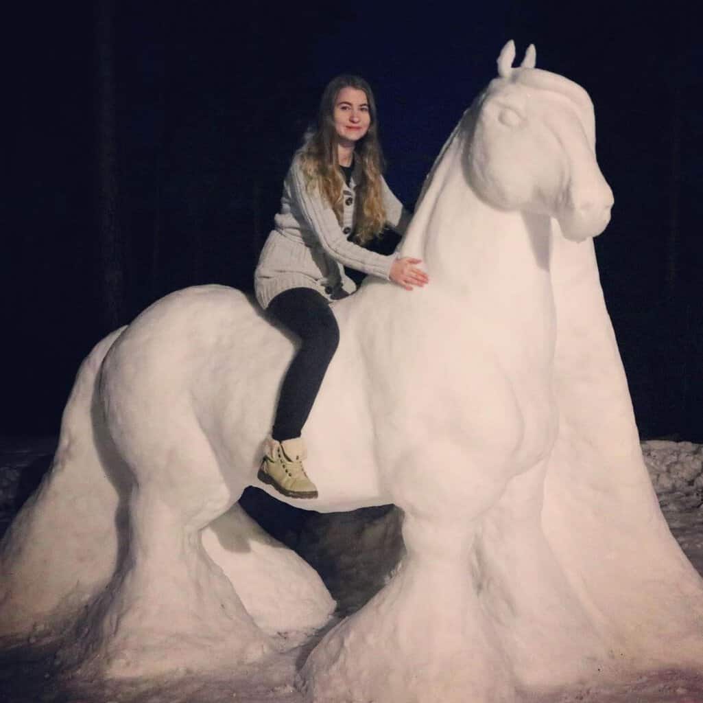 Woman riding a horse snow sculpture