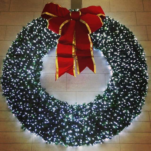 Wall decorated with a big Christmas wreath