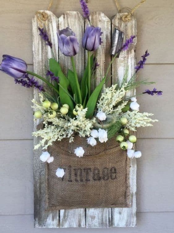 Wooden plate with a pocket to hold flowers for front porch decoration