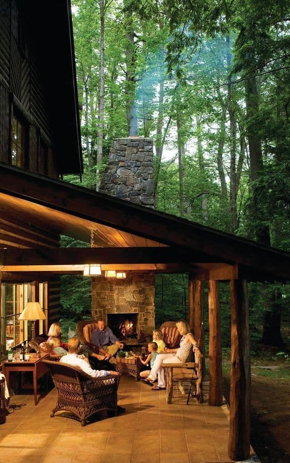 11 Backyard Pavilions Ideas You Didn’t Know You Needed: Family gathered in their Pavilion 