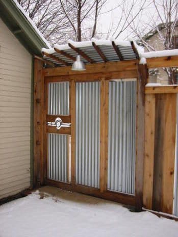 roof on top of a corrugated gate  #fenceGate #fence #gardenfence #gardenfenceideas #privacyfenceideas #privacyfence #backyardLandscaping #backyardLandscapingIdeas #landscaping #gardenfence #gardenfenceideas #privacyfenceideas 