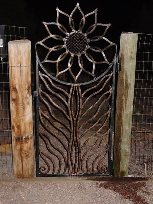 metal gate with a big flower design #fenceGate #fence #gardenfence #gardenfenceideas #privacyfenceideas #privacyfence #backyardLandscaping #backyardLandscapingIdeas #landscaping #gardenfence #gardenfenceideas #privacyfenceideas 