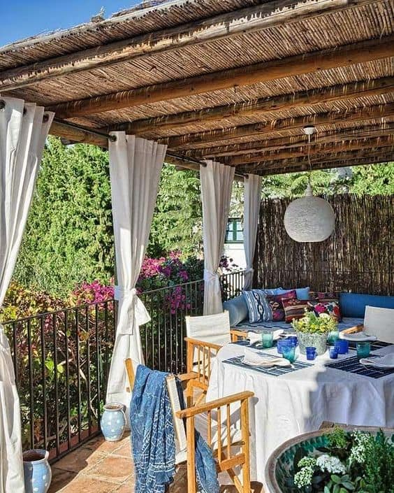 beach vibe patio with neutral shade curtain that complement the furniture fabric design  #patioideas #patiodeck #outdoorSpace #outdoordecor #patiodecor #patio #outdoorliving #outdoorFurniture#outdoorCurtains #patioshade