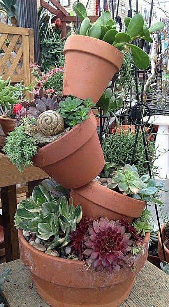 plant tower using 4 flower top arrange from big to smallest  #flowers #containers #planters #gardenplanters #garden #backyardLandscaping #backyardLandscapingIdeas #landscaping #cheapLandscapingIdeas #backyard #landscaping #curbAppeal