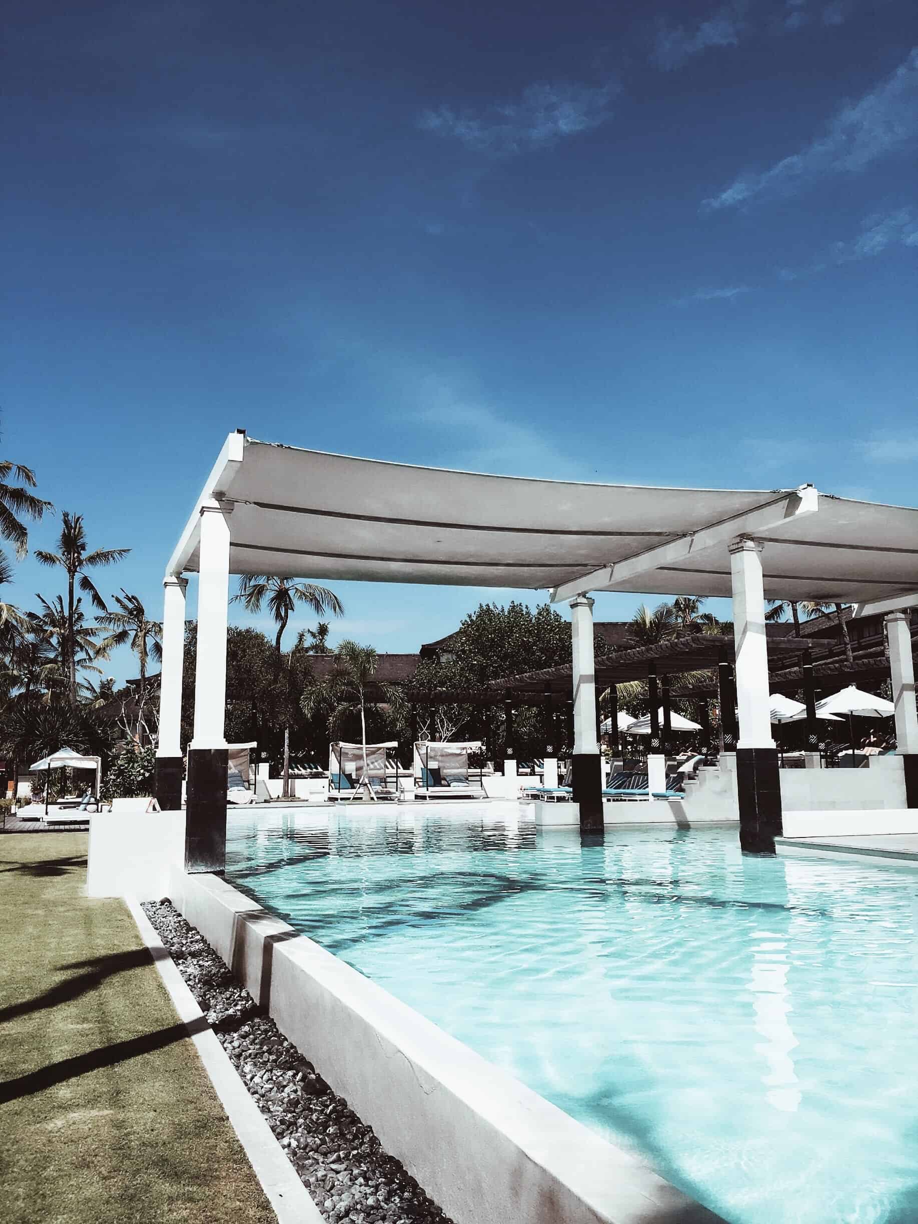 One of the ways to put a shade over your swimming pool is to install a permanent shade structure #pool #shade #backyard #outdoor #howto 