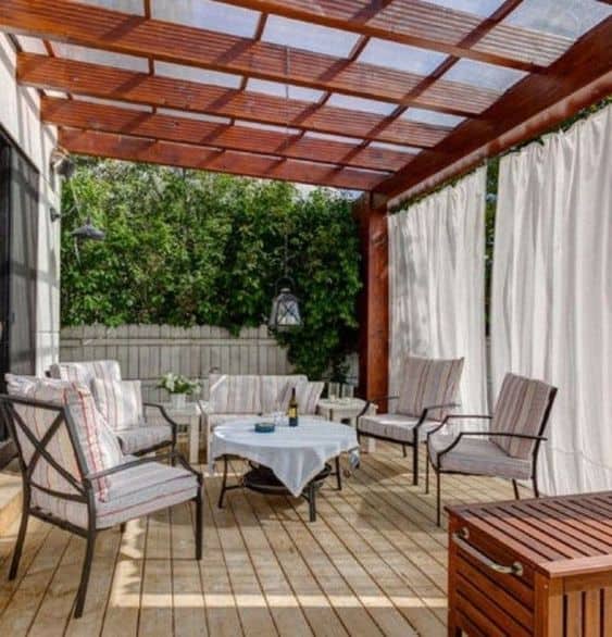 wood and transparent panels for a pergola cover #pergola #backyardLandscaping #backyardLandscapingIdeas #landscaping #cheapLandscapingIdeas #landscape #pavilion #curbAppeal #outdoorliving #outdoorShade