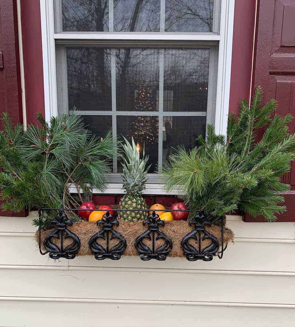 Window decorated with leaves and fruits
