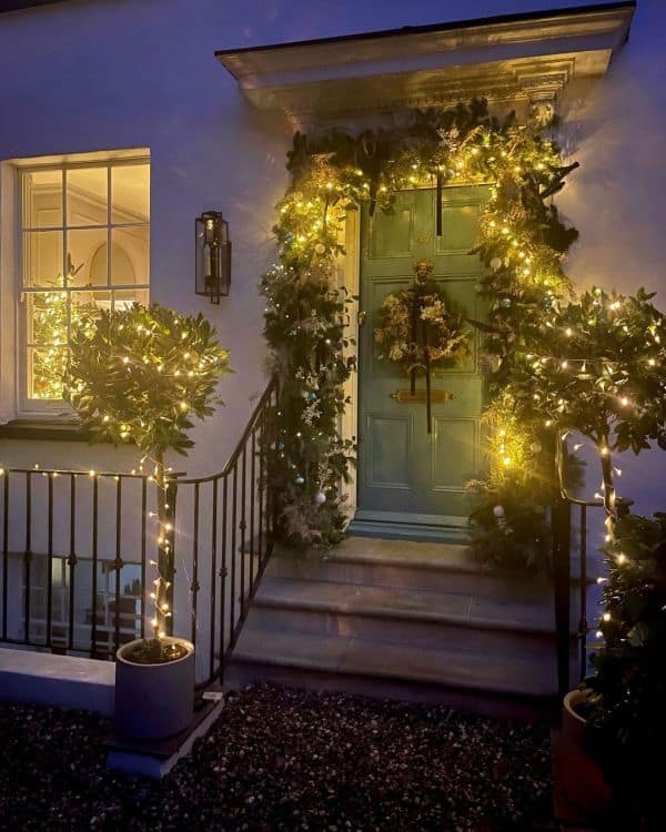 Christmas front door decoration with string lights