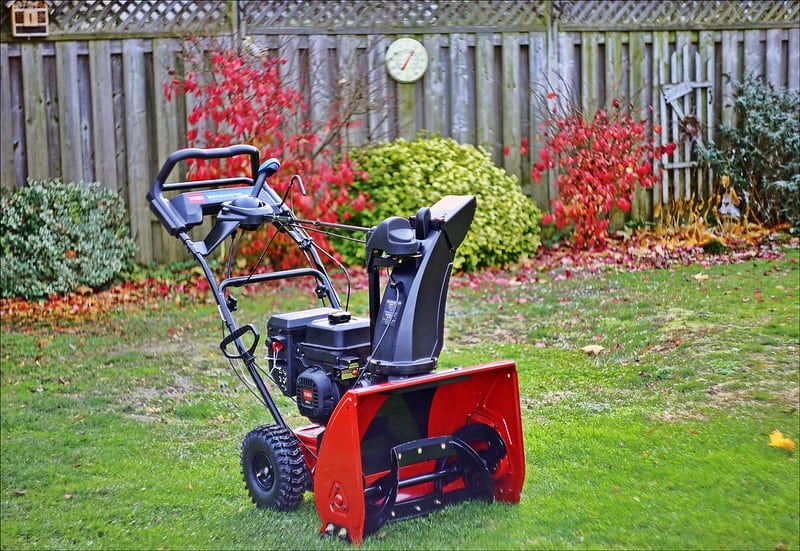 A snow blower in a lawn