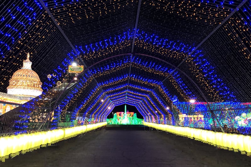 A big walkway decorated with Christmas decoration lights