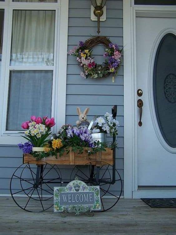 Easter station with a wreath on your porch #easter #backyardporch #porchIdeas #frontDoorDecor #frontDoorWreaths #frontDoorWreath