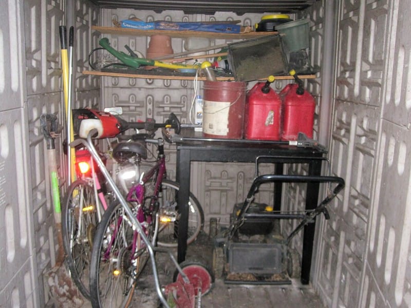 A lawn mower stored in a storage space
