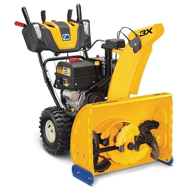 A cub cadet 3-step snow blower in white background