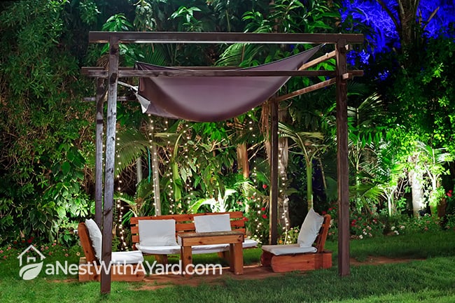 Romantic pergola cabana on a backyard set-up with lights