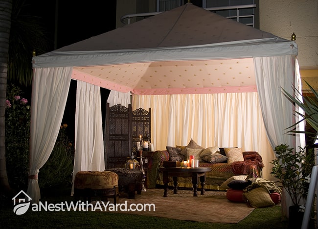 Tent-like backyard cabana design that looks cozy specially at night