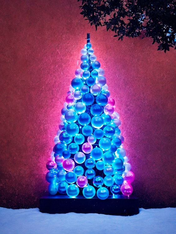 A Christmas tree made with blue and pink glass balls