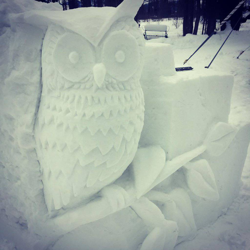 Owl sculpture crafted from snow
