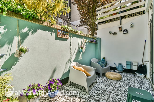 A patio with colourful and beautifully decorated walls