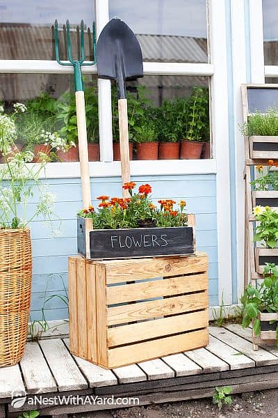 Potted flower on a crate as porch decoration