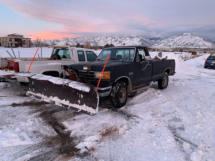 Snow plow attached to a truck