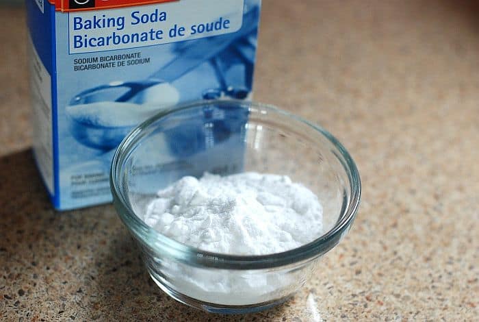 A box and a small bowl of baking soda