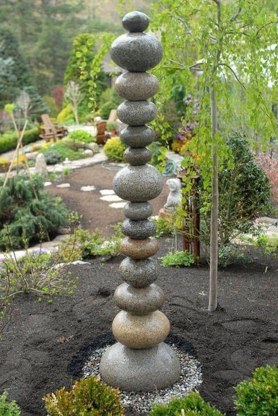 Stones balancing on top of each other #gardenSculptureIdeas #garden #landscaping #pebbles