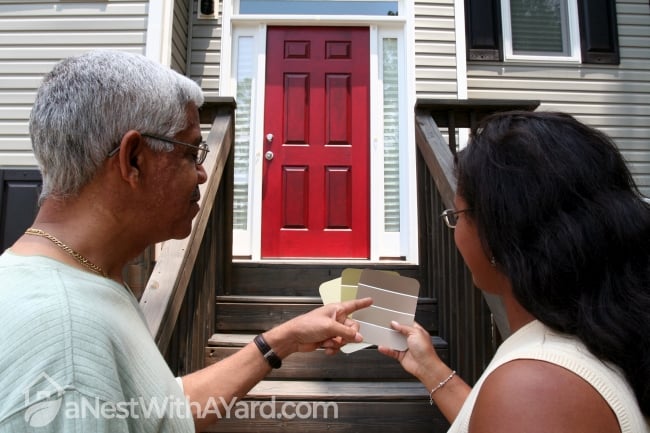 Man and woman deciding a door colour