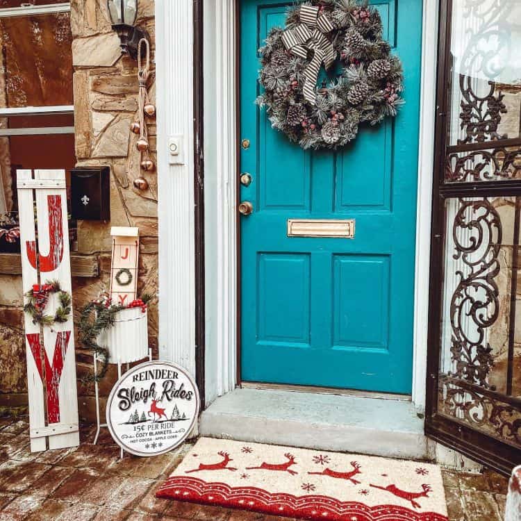 Front door decorated for Christmas in vintage style