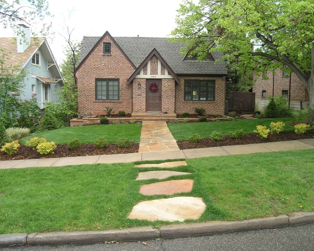 A front lawn decorated with a stepping stone path