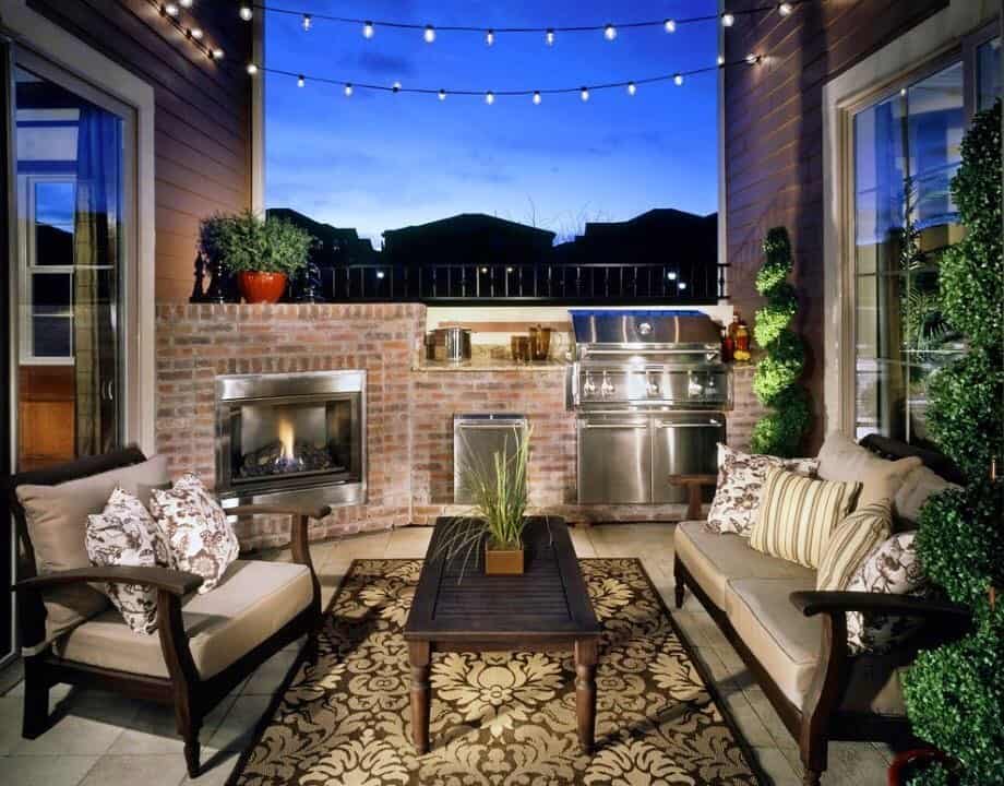 Patio design with fireplace and open kitchen arrangement