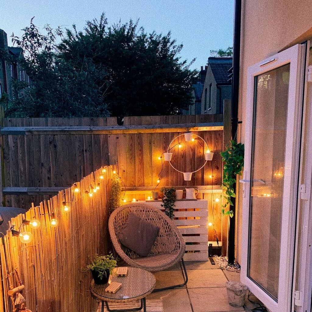 Single chair patio decorated with lights