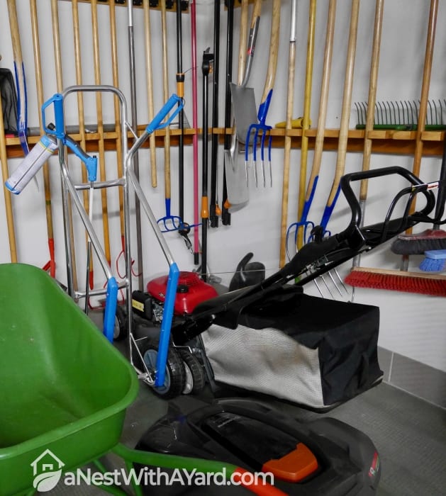 A lawn mower stored in an indoor storage place
