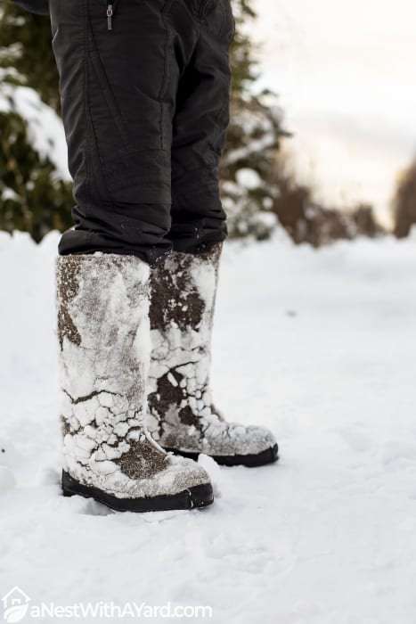 A man wearing a sturdy boots in winter season